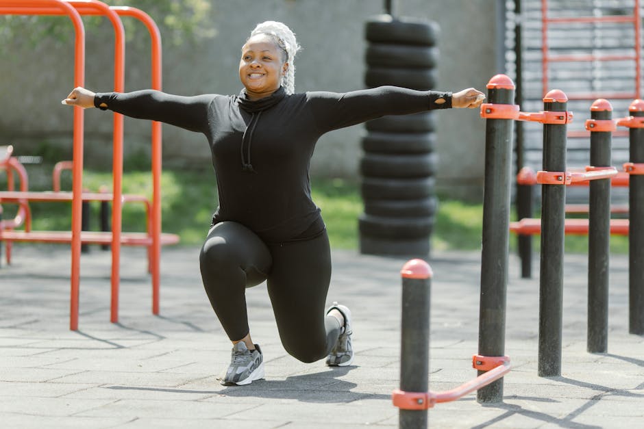 African American woman exercising in a park, promoting a healthy lifestyle